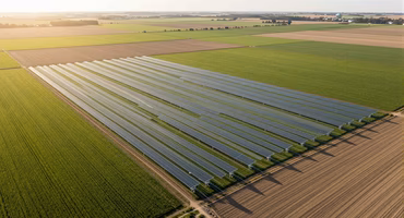 Drone surveying farmland with sensor network for precision agriculture