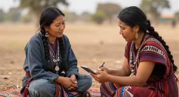Field linguist documenting an endangered language with community members